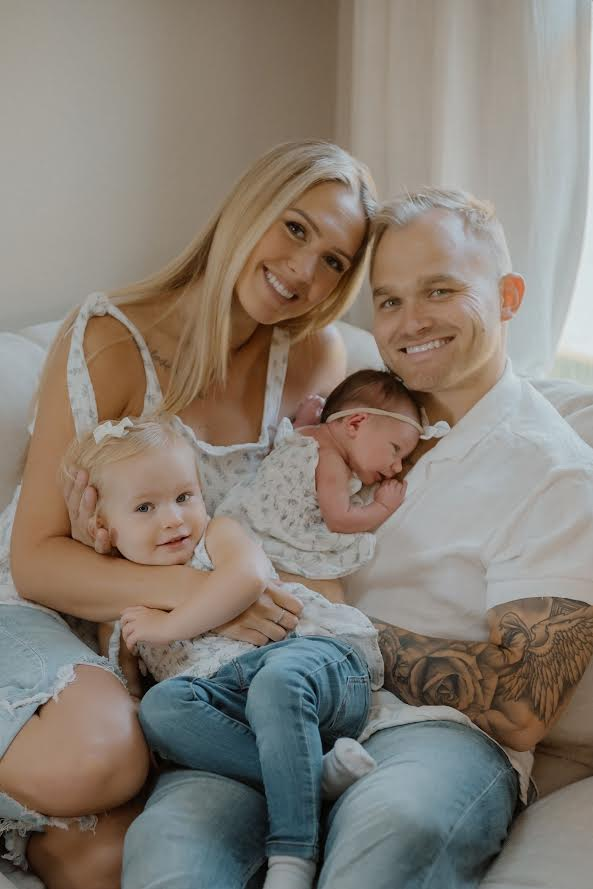 Austin Monday, owner of Monday Electric, with his family