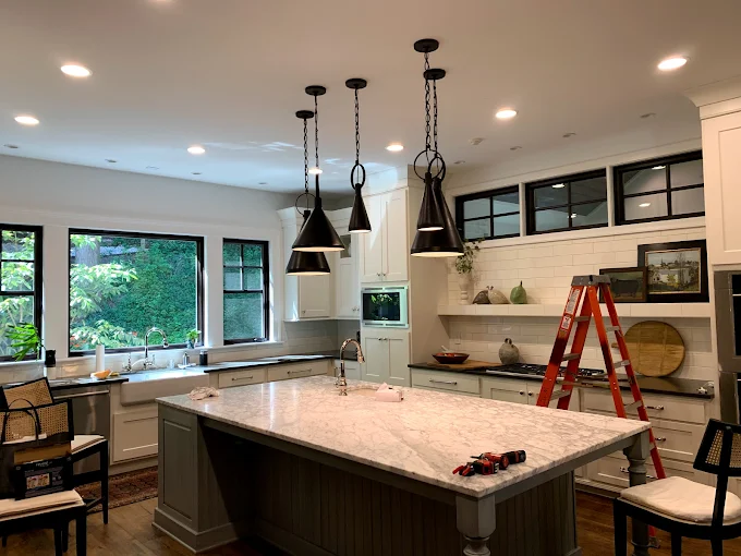 Designer pendant lighting installed by Monday Electric in a luxury North Texas kitchen