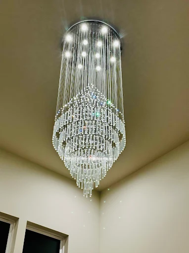 Crystal chandelier installation in a North Texas home