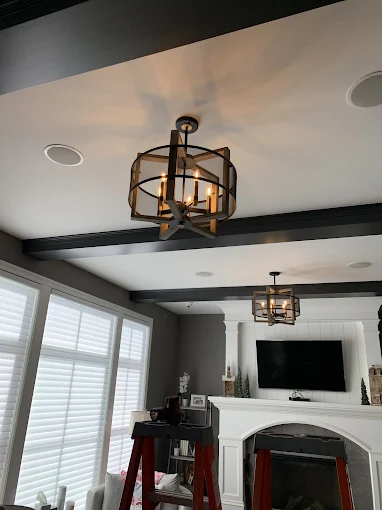 Lantern pendants and recessed lighting in a living room
